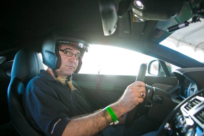 Las Vegas Sun writer John Katsilometes in the Aston Martin VantGE S before heading out on to the track at Exotics Racing Las Vegas, Thursday Oct. 15, 2012.